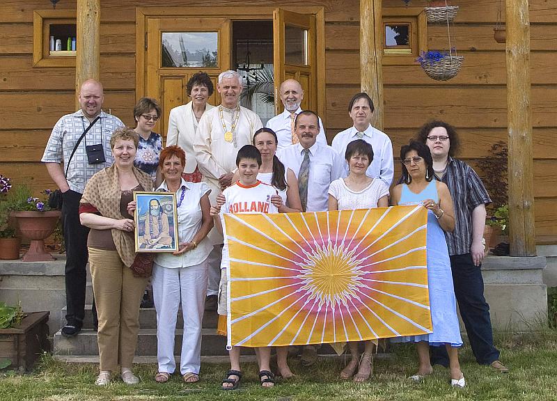 02 photo.jpg - Leading members of the Global Country of World Peace in Pland hold the flag of the Global Country of World Peace.